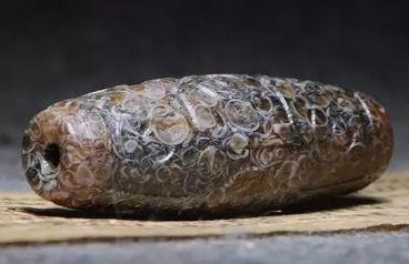 翡翠原石有紫色的吗天珠九眼为尊，像这个在市场上价值如何？  第4张