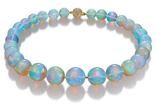 翡翠原石稳欧泊石的价格和它的变彩有关系吗？  第1张